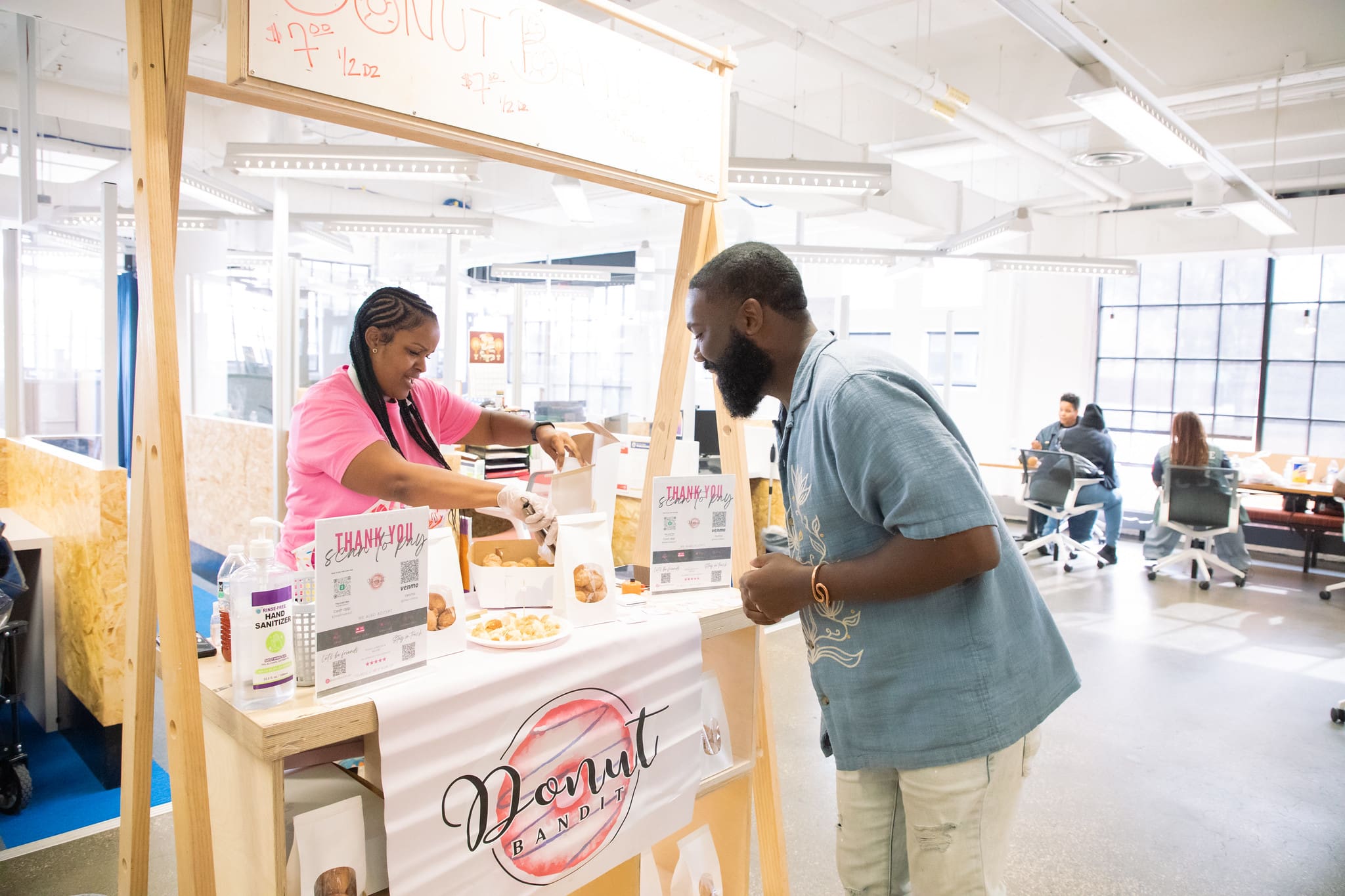 Image of two people people talking during our The SHOP event.