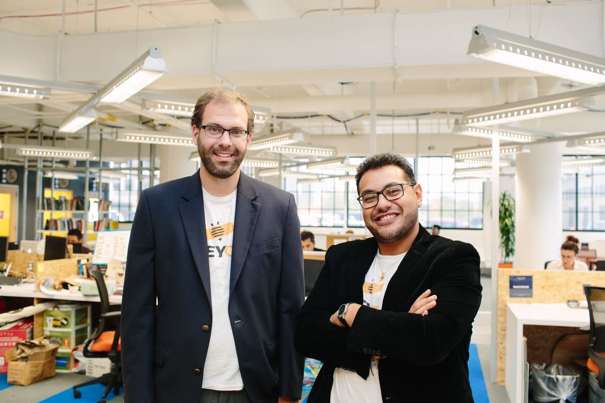 Photo of Ramy Habib and Sean Carroll wearing HoneyCure shirts at TechTown Detroit