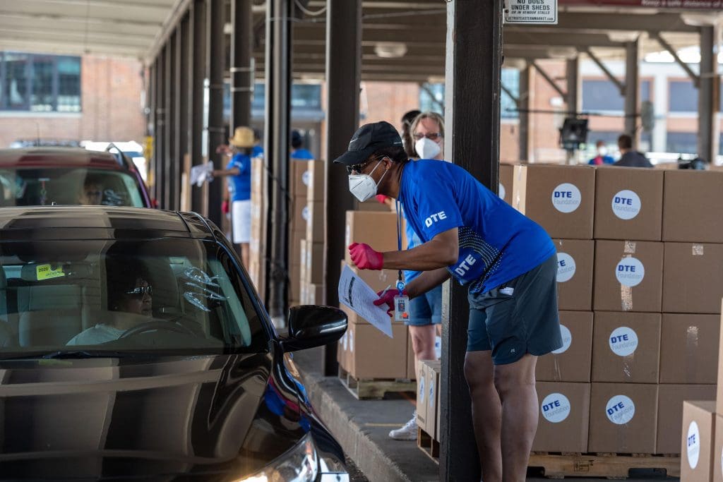 DTE Energy volunteers distribute PPE to small businesses in Detroit at Detroit’s Eastern Market.