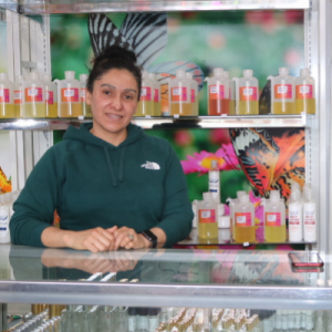 Photo Mary Ortega at the counter of her small business