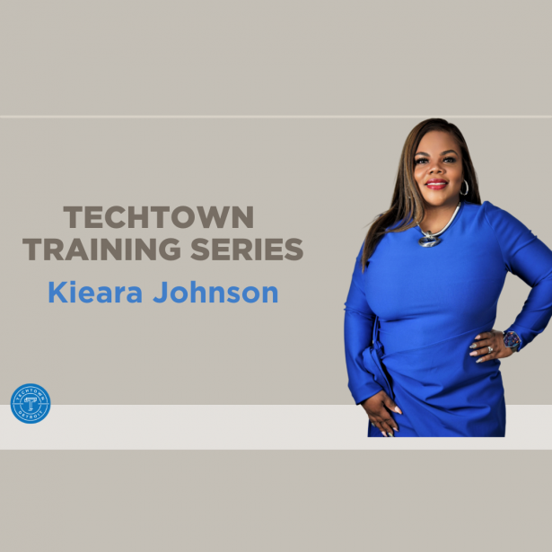 Women of color in a blue long sleeve dress representing the TechTown Training Series