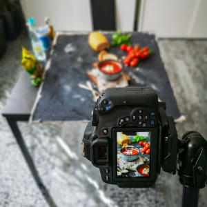 Behind the scenes photoshoot of soup using a DSLR camera and tripod