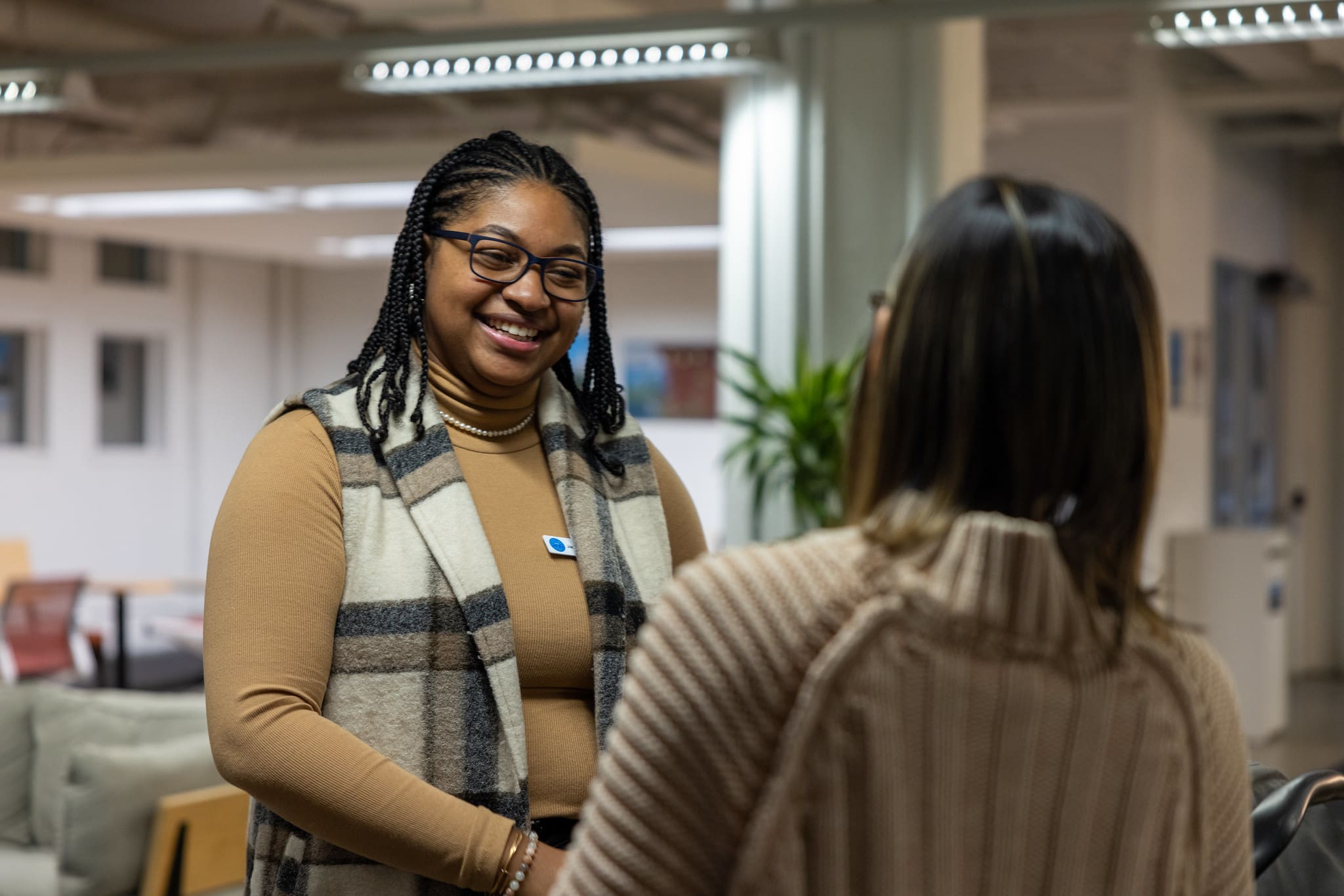 Two women talking at TechTown Detroit's office location