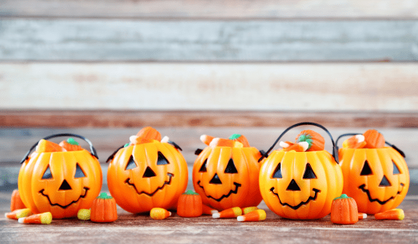 A photo of jack o'lanterns and candy corn