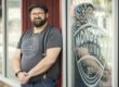 Zach Berg stands outside of his brick-and-mortar for Mongers' Provisions