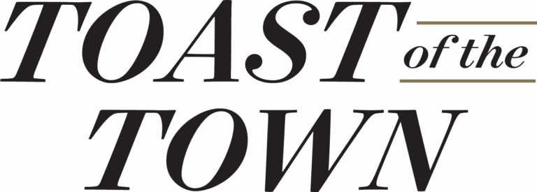 The "Toast of the Town" logo, which is spelled out in a italicized serif font with black lettering and gold accents.